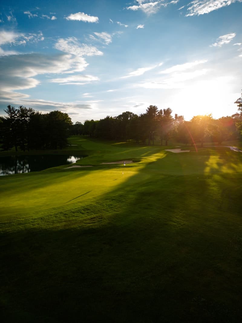 Sunlit parkland at Regnum Carya, Belek